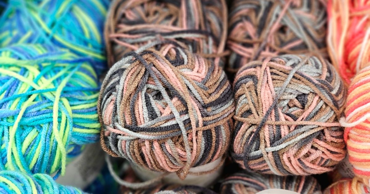Close-up of colorful yarn balls showcasing vibrant patterns ideal for knitting and crocheting projects.