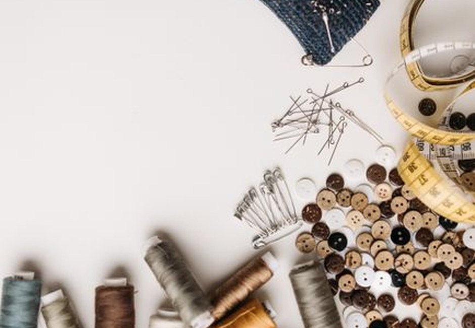 Sewing essentials including threads, buttons, and pins