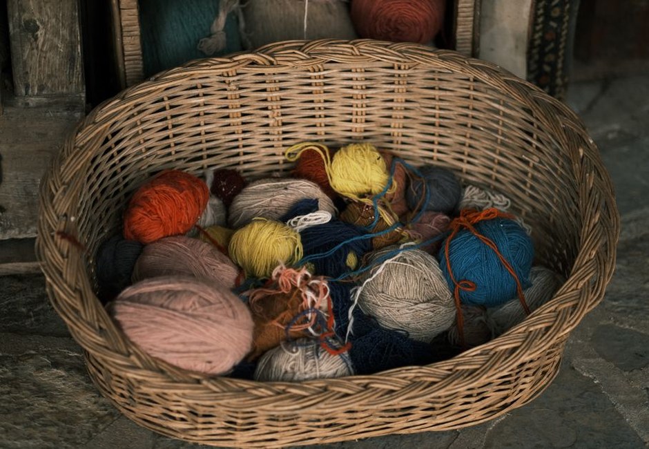 Colorful yarns in a woven basket